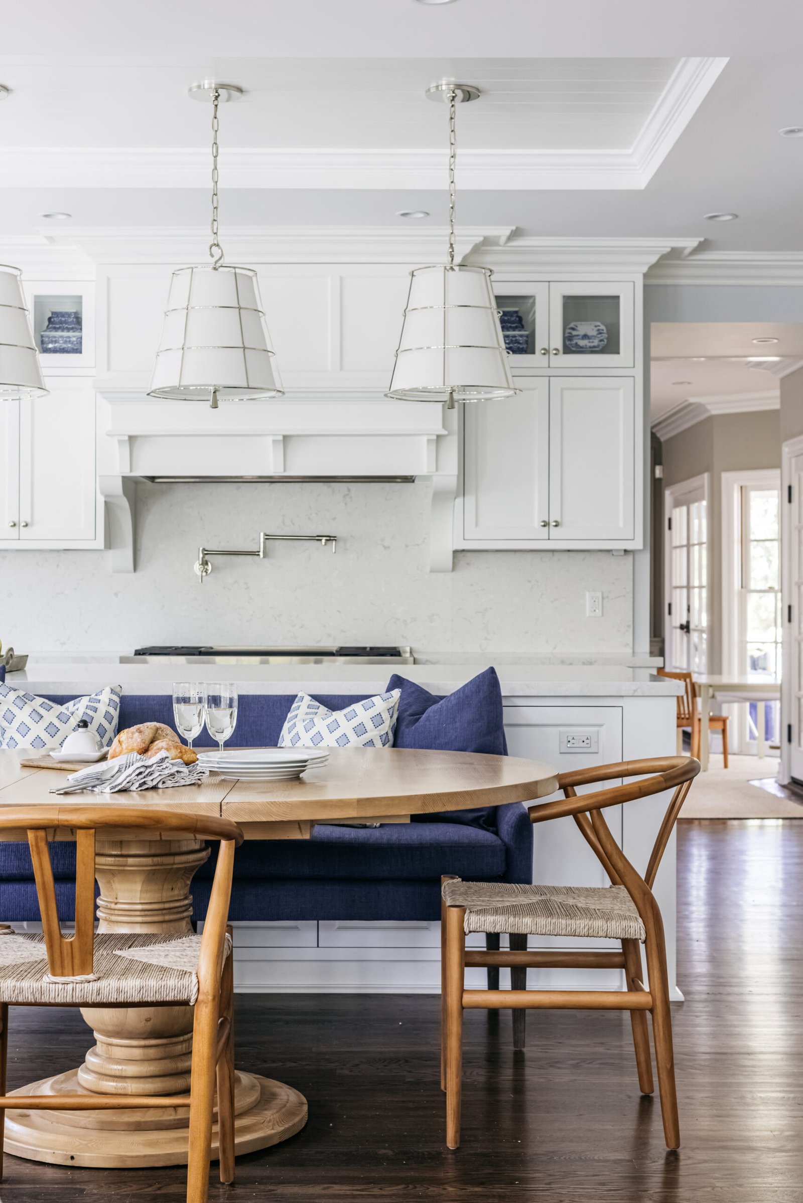 Historic preservation - kitchen designed by Coco Maison with custom banquette and island.