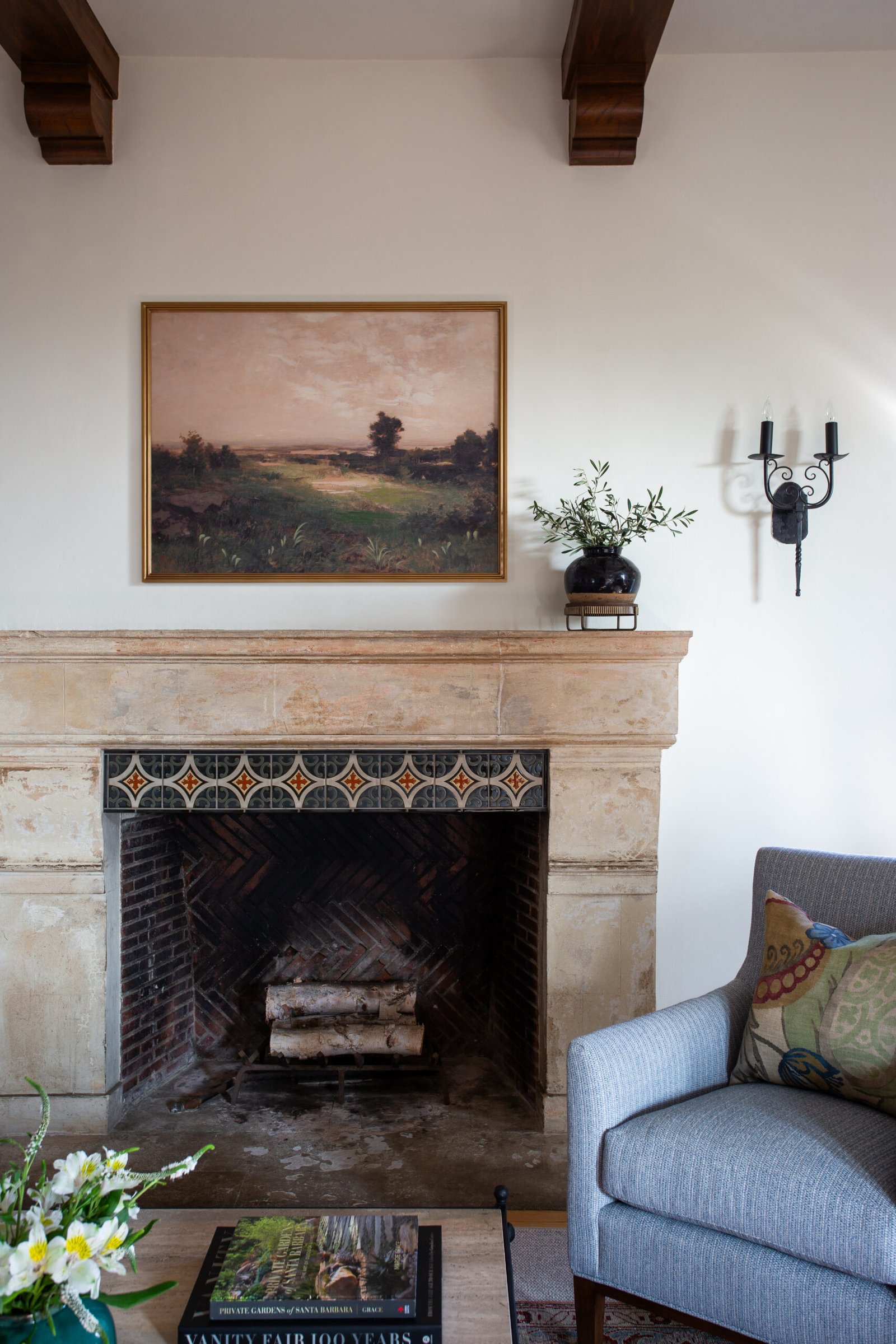 Historic preservation of a living room fireplace, designed by Coco Maison.